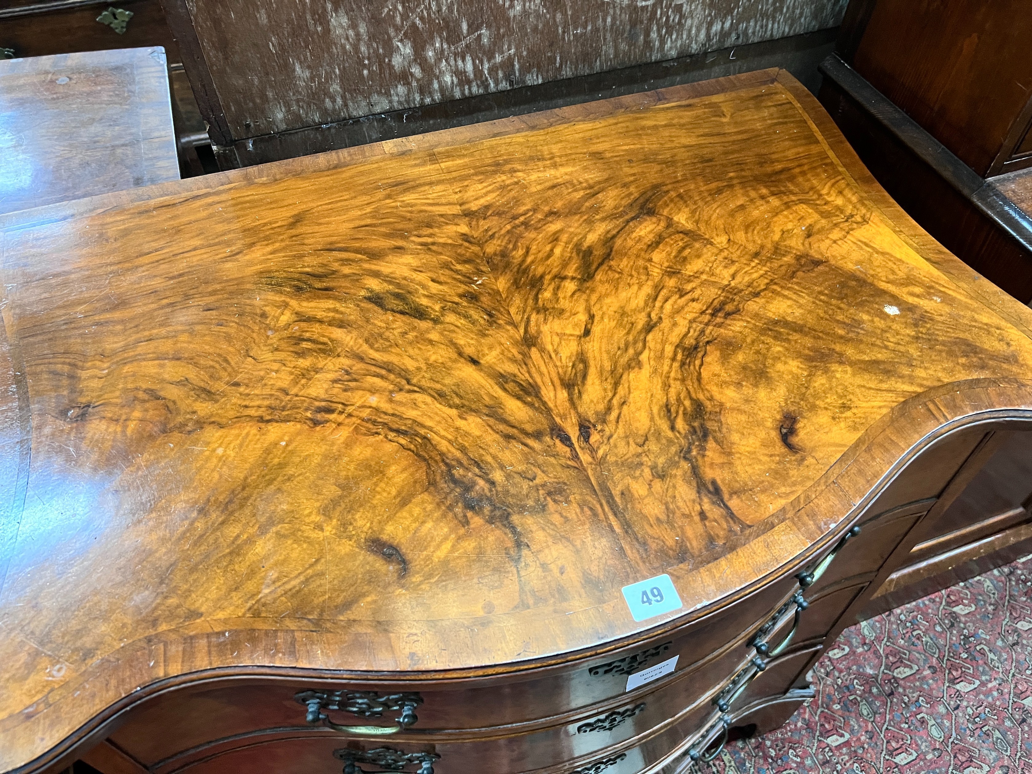 A George III style walnut serpentine fronted chest, fitted four long graduated drawers, width 82cm, depth 53cm, height 86cm *Please note the sale commences at 9am.